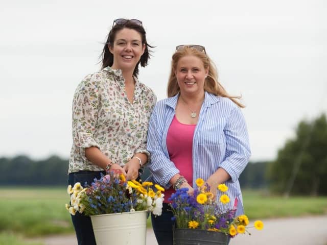 Clare Ashcroft and Alison Matthews picking flowers at their flower farm in Burscough.