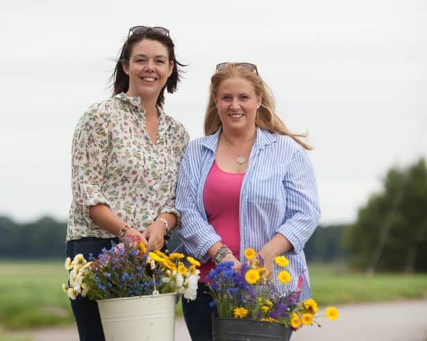 Clare Ashcroft and Alison Matthews picking flowers at their flower farm in Burscough.