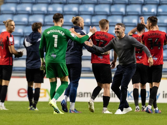 Lowe and goalkeeper Freddie Woodman go towards the fans after PNE's second league win this season, a 1-0 win over Coventry City