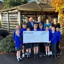 Pupils of St Chads with teachers, Councillor Alf Clempson and Persimmon Lancashire MD, Anthony Mansf