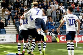 Preston North End players mob Alan Browne after he scored the opening goal