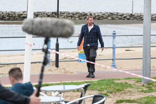 Actors perform on Morecambe Promenade for the latest series of ITV series The Bay