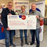 Si (left) and Den with neighbour Anna Molloy-Johnston present the donation. Photo:  Rosemere Cancer Foundation
