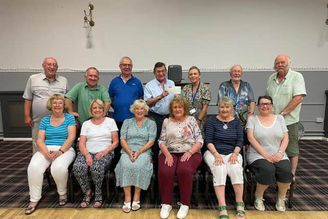 Members of St Mary's Parish Centre in Chorley presented Rosemere Cancer Foundation’s community fundraiser
Yvonne Stott (third from the right), with a cheque for £500 - proceeds of a bonus ball game they held