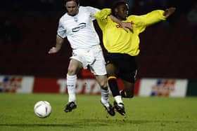 WATFORD - MARCH 4:  Graham Alexander of Preston North End uses his strength to take the ball past Jason Norville of Watford during the Nationwide League Division One match held on March 4, 2003 at Vicarage Road, in Watford, England. Preston North End won the match 1-0. (Photo by Bryn Lennon/Getty Images)