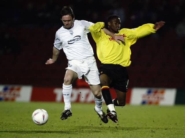 WATFORD - MARCH 4:  Graham Alexander of Preston North End uses his strength to take the ball past Jason Norville of Watford during the Nationwide League Division One match held on March 4, 2003 at Vicarage Road, in Watford, England. Preston North End won the match 1-0. (Photo by Bryn Lennon/Getty Images)