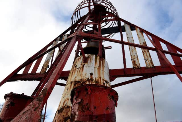 Photo Neil Cross; The Nelson red â€˜bell-boatâ€™ buoy at the entrance to Preston Docklands