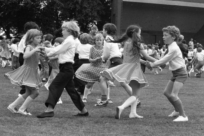 Over 1,000 schoolchildren crowded on to Preston's Avenham Park for an afternoon of singing and dancing. The children came from 28 primary school in Preston, Leyland and district to take part in Preston's 42 annual Children's Festival of English Folk Dancing. Pictured: Boys and girls of St Gerard's Junior School, Lostock Hall, dancing in the festival