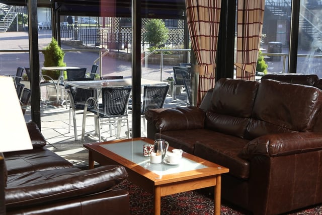 Hotel lounge with a view of the courtyard at Park Hall Hotel, Charnock Richard