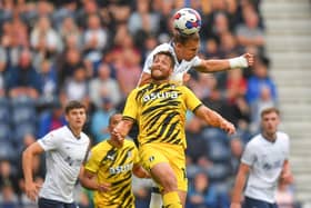 Preston North End's Brad Potts battles with Rotherham United's Conor Washington.