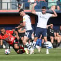 Preston North End's Andrew Hughes challenges Luton Town's Carlton Morris