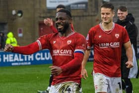 Morecambe skipper Yann Songo'o celebrates Saturday's win against Swindon Town Picture: Morecambe FC
