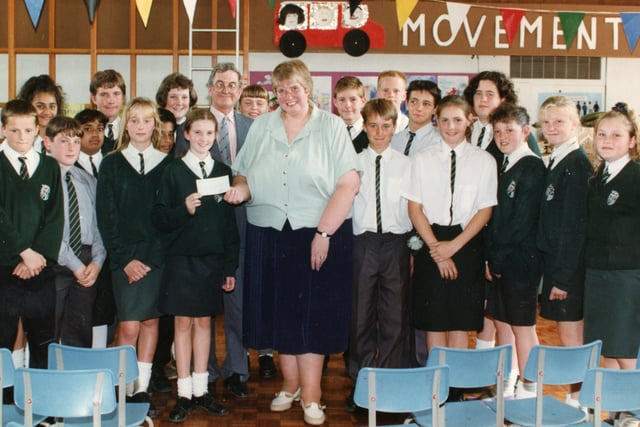 Longstanding links between two Preston schools were truly bonded when one set of pupils raised £1,000 for their counterparts at a special school. Pupils at Fulwood High School, Preston, sent the whole year collecting cash for the Elms School, Moor Park. Pictured: Fulwood pupils hand over a cheque to Elms head teacher Janet Bacon