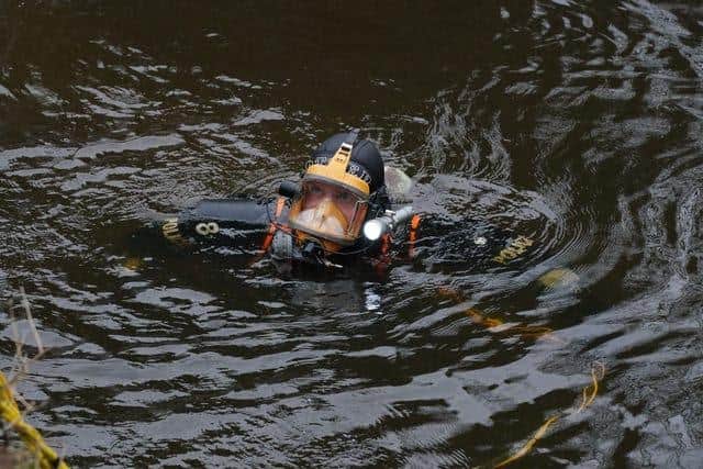 A diver searches in the River Wyre, in St Michael’s on Wyre. Credit: Peter Byrne/PA
