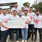 Joe, second left, and his National Three Peaks team with their Children’s Fund donation