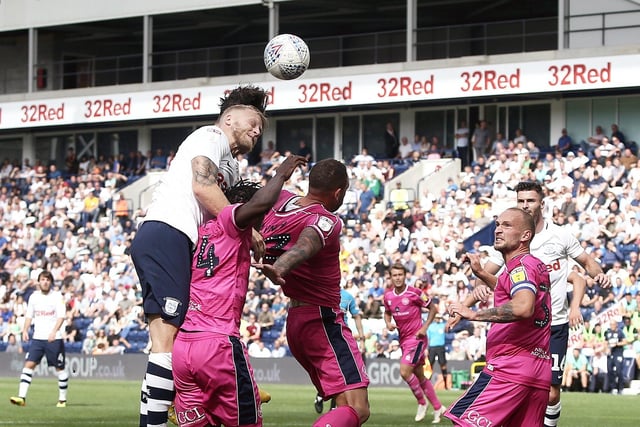 Preston North End's Alan Browne (obscured behind team-mate Tom Clarke) scores the opening goal with a looping header