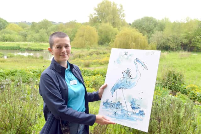 WWT's Leanne McCormella with one of the illustrations