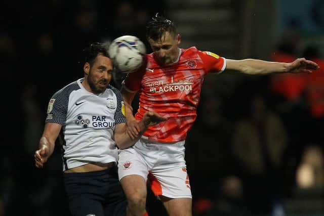 Preston North End wing-back Greg Cunningham challenges Blackpool's Callum Connolly