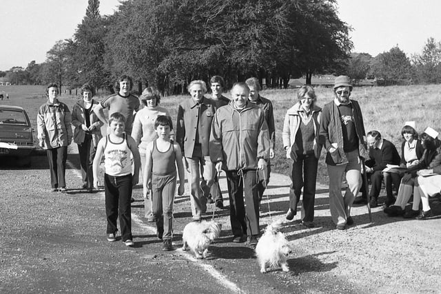 Elephants never forget, so they say. And more than 30 animal lovers have put their best feet forward to prove they haven't forgotten the elephants. The enthusiasts gathered for a sponsored walk around Preston's Moor Park. Preston South MP Mr Stan Thorne was one of the first to arrive. Picture shows Mr Thorne, with dogs Jason and Duffy, among the walkers