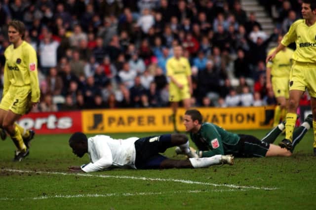 Patrick Agyemang scores Preston North End's first goal against Millwall at Deepdale in January 2006