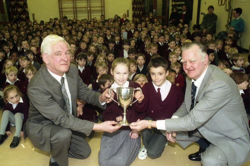 Children from Ingol Pool House School, Preston, have won a top trophy for safe cyclists. The school, on Kidsgrove, Tanterton, was awarded the Jack Heatley cycling trophy for the best overall results in 1991. Pictured above: Left to right, Coun Jack Heatley, Lindsay Craig, Glen Hillage and Mr Ken Chapman