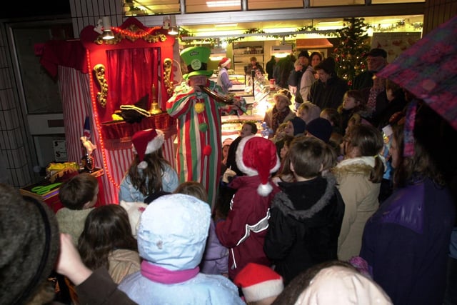 A clown entertains the children at the Victorian Christmas night in Garstang