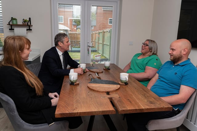 Labour leader Sir Keir Starmer chats with residents, Ryan Barker and Catherine Watkis, inside their newly built home during a visit to a Leyland housing development with Deputy Leader Angela Raynor.  Photo: Kelvin Stuttard