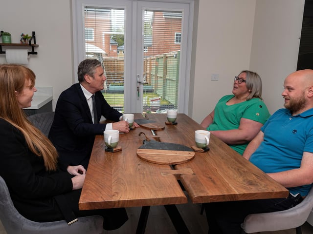 Labour leader Sir Keir Starmer chats with residents, Ryan Barker and Catherine Watkis, inside their newly built home during a visit to a Leyland housing development with Deputy Leader Angela Raynor.  Photo: Kelvin Stuttard