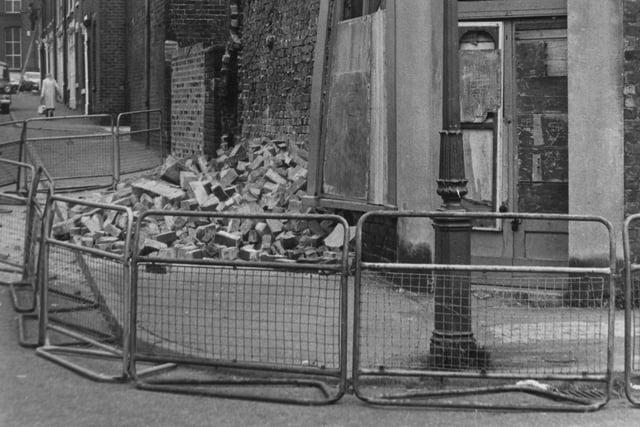 Rubble left on the pavement from a property on the corner of Birley Street in Preston in 1975