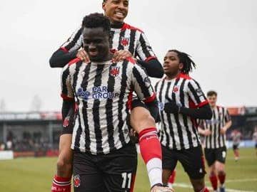 Momodou Touray (front) celebrates his opener with Kole Hall and Dubem Eze(photo: David Airey/dia_images)