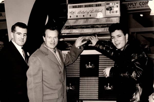 A young Cliff Richard with guitarist Burt Weedon and jukebox sales manager, Mike Town.