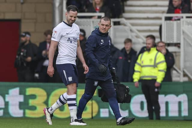 Preston North End's Greg Cunningham grimaces as he is substituted due to an injury