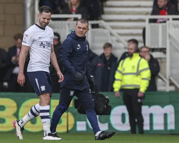 Preston North End's Greg Cunningham grimaces as he is substituted due to an injury