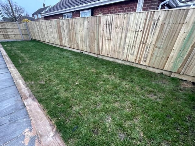 Side pathways lead to the back garden, where there is a good-sized patio and two further lawned areas, all offering a good degree of privacy.
