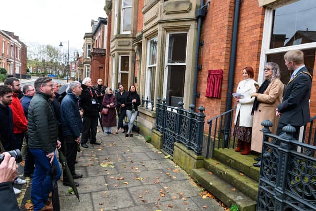 Speeches at the unveiling of the blue plaque were listened to by the crowd of attendees.