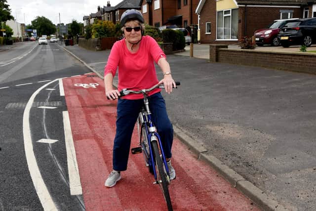 Irene looks forward to a cup of tea after trying out the new cycle lane       Photo: Neil Cross