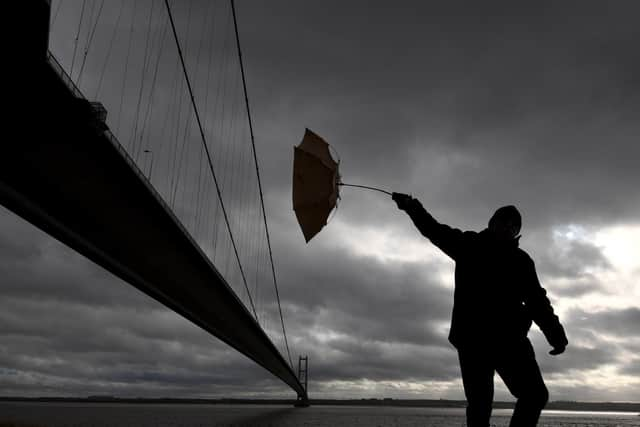 An umbrella rebelling against its moist user in the wild.