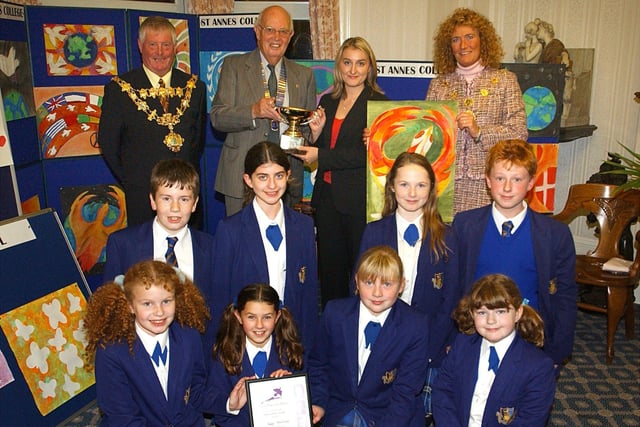Children from St Annes College Grammar School with (back left to right ) Mayor of Fylde Trevor Fiddler, president of Lytham St Annes Lions Club David Shaw, teacher Rachel Parkinson, and Mayoress of Fylde Linda Burn, being presented with the Peace Poster Competition at St Annes Town Hall