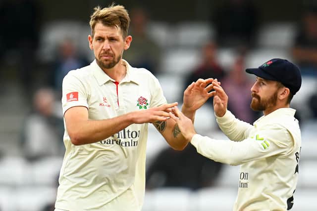 Lancashire bowler Tom Bailey, left,  celebrates the wicket of Lewis Goldsworthy of Somerset with team mate Josh Bohannon during the County Championship match between Somerset and Lancashire.