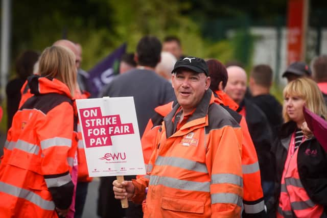 Postal workers on strike outside the Royal Mail delivery office in Bispham