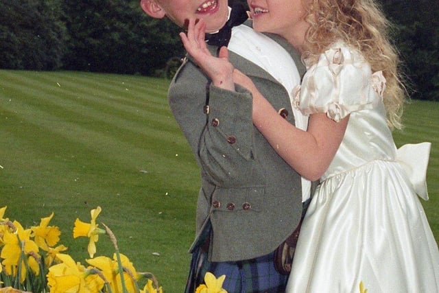 Scores of brides-to-be packed out Preston's Marriot Hotel for their popular annual wedding fayre. Pictured above Keaton Dickinson, eight, and his sister Lucinda, seven, of Lytham, modelling wedding clothes for the fayre