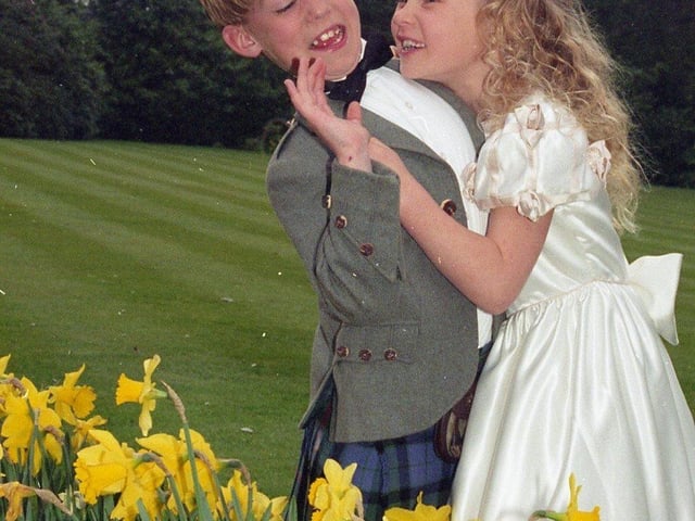 Scores of brides-to-be packed out Preston's Marriot Hotel for their popular annual wedding fayre. Pictured above Keaton Dickinson, eight, and his sister Lucinda, seven, of Lytham, modelling wedding clothes for the fayre
