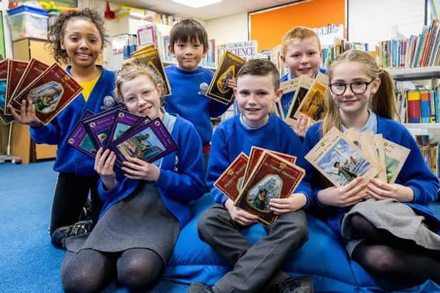 Pupils of Barnacre Primary School with donated books from David Wilson Homes