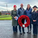 Image of Chief Executive Chris Oliver holding poppy wreath with Joanna Stark on the left, Delivery Director, Chris in the middle, Amy Devine, Associate Director of Operations in the Pennine network and Lesley Davison, Lead Engagement Officer