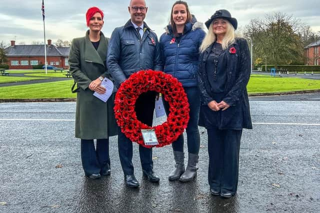 Image of Chief Executive Chris Oliver holding poppy wreath with Joanna Stark on the left, Delivery Director, Chris in the middle, Amy Devine, Associate Director of Operations in the Pennine network and Lesley Davison, Lead Engagement Officer