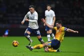 Preston North End's Sam Greenwood battles with Derby County's Eiran Cashin