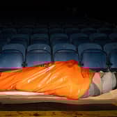 David Sergeant tries to keep warm during the big PNE Sleep out at Deepdale. Photo: Kelvin Lister-Stuttard