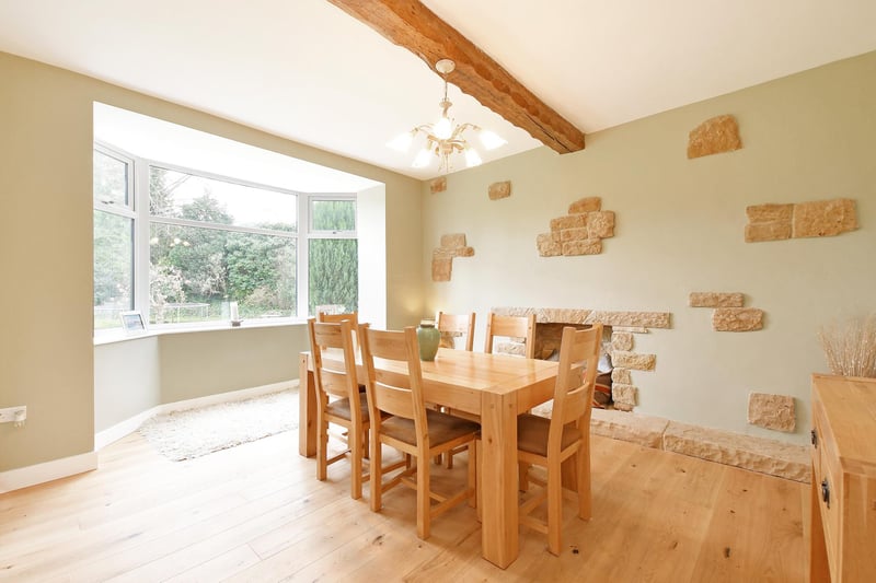 The property brochure says the dining room is fantastic, ideal for formal dining with exposed timber beam and oak flooring. There’s also a feature wall, which incorporates exposed stone and a decorative fireplace with a stone mantel, surround and hearth.