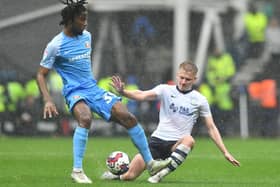 Preston North End's Ali McCann battles with Sunderland's Pierre Ekwah