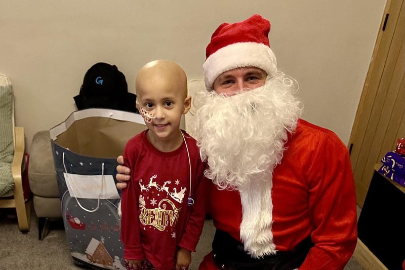 'Santa' with one of the grateful children